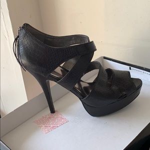 Black leather snake print heels by Carlos Santana
